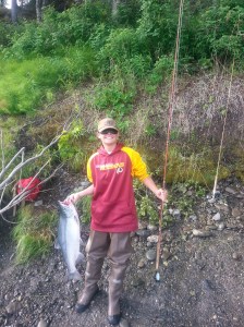 Tristan with a Salmon. Caught with his Great Grandmother's fly rod.