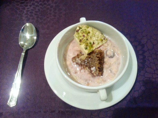 Yogurt with fresh honeycomb....and a pistachio candy 'thing'.
